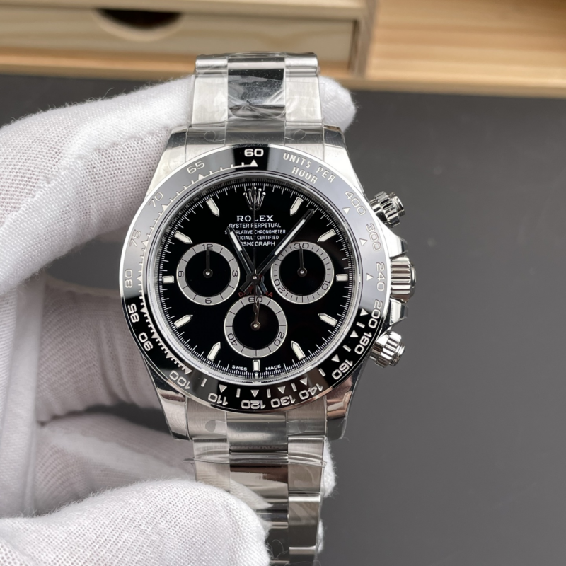 Macro view of the VSF Daytona 126500LN black dial, showing the reference-specific metallic silver sub-dial rings, slim markers, 6 o'clock Coronet, metal-edged ceramic bezel, and DD4131 alignment.