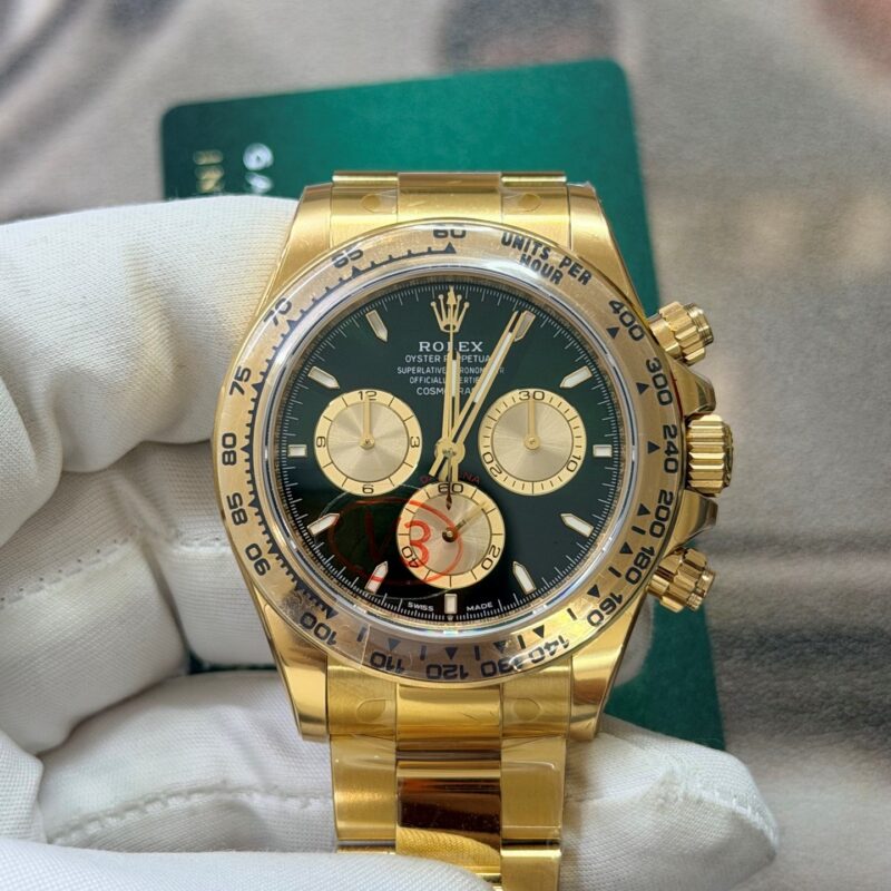Macro view of the VSF Daytona 126508 Tungsten Heavyweight green dial, showing the solid 18K gold markers, 6 o'clock Coronet, engraved gold bezel, and DD4131 alignment.
